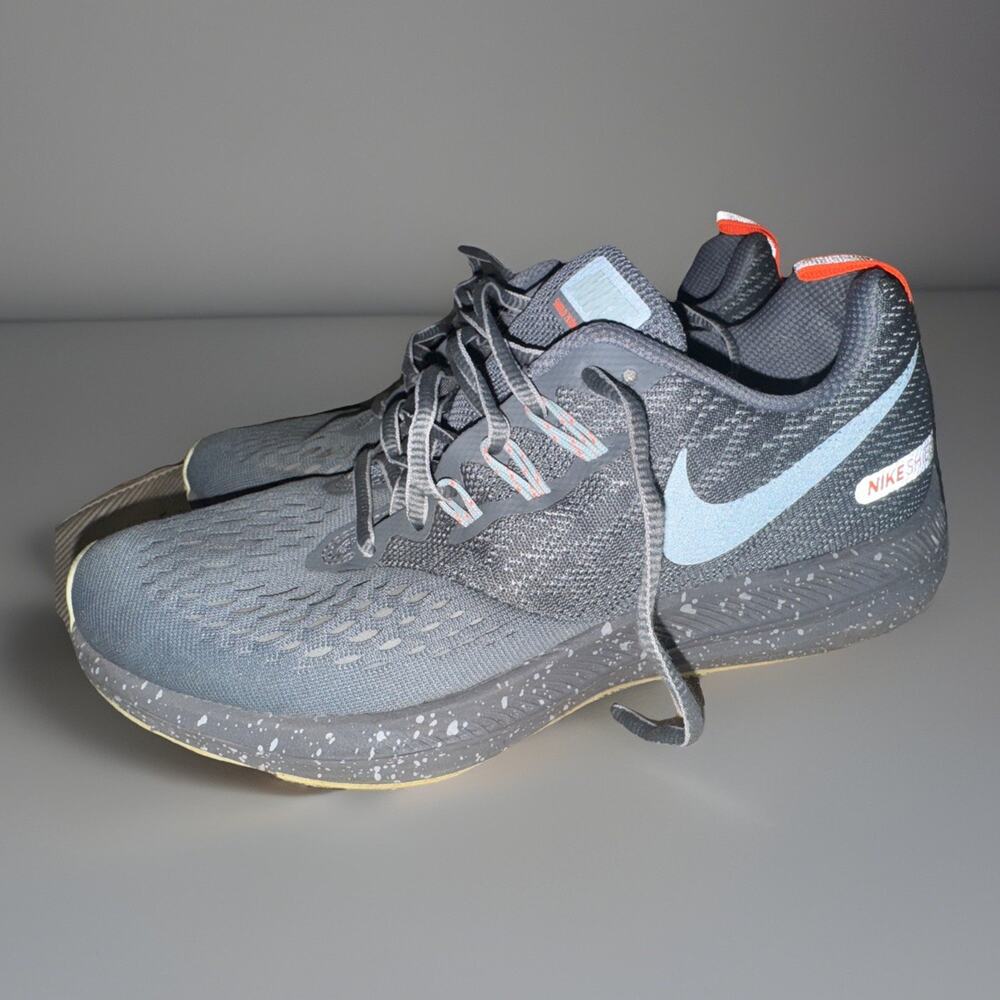 Nike Women's Gray & Light Blue Sneakers with Orange Accents